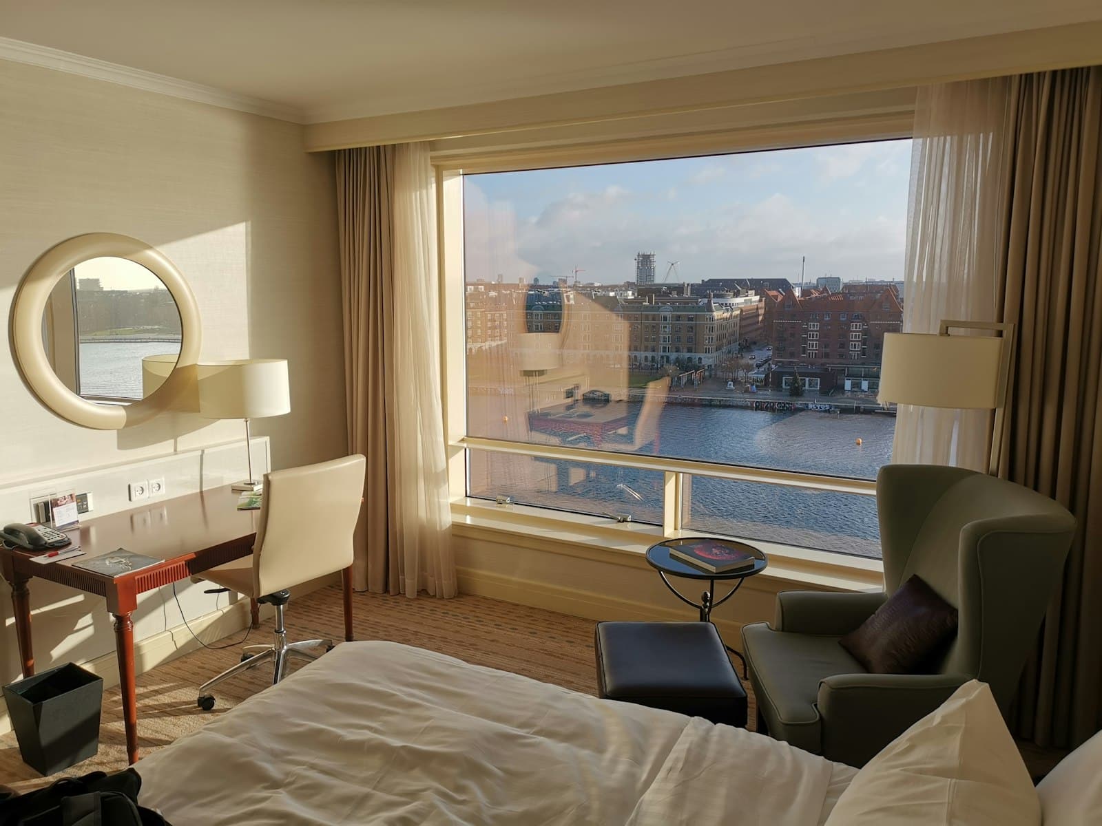 Hotel room with taut linen and muted light